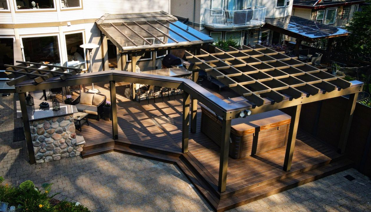 Spiced Rum decking & fascia, lighting package, and beautiful fir pergola system to compliment this amazing outdoor space complete with outdoor kitchen and gas fireplace.