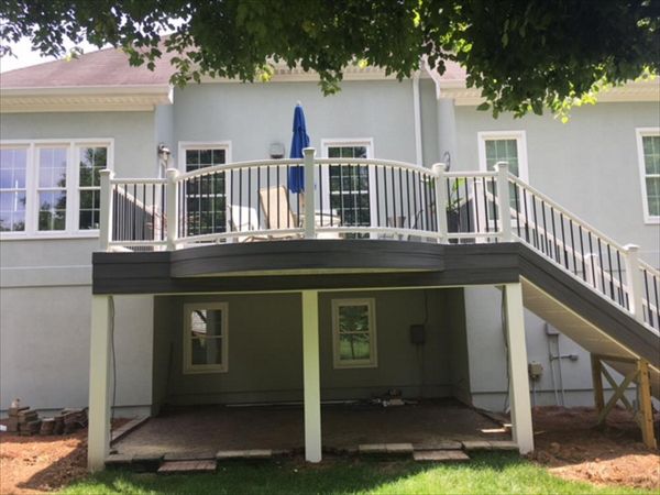 Unique, curved Trex Transcend Island Mist deck with Transcend White handrails & Trex RainEscape in Clemmons, NC.