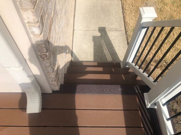 Trex Select Saddle with Woodland Brown picture frame helps suggest a change visually when it comes to the stairs