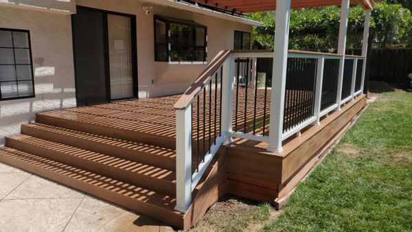 Tiki Torch with White Trex Railing