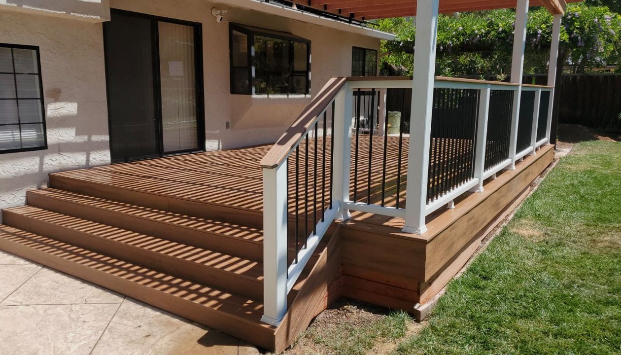 Tiki Torch with White Trex Railing