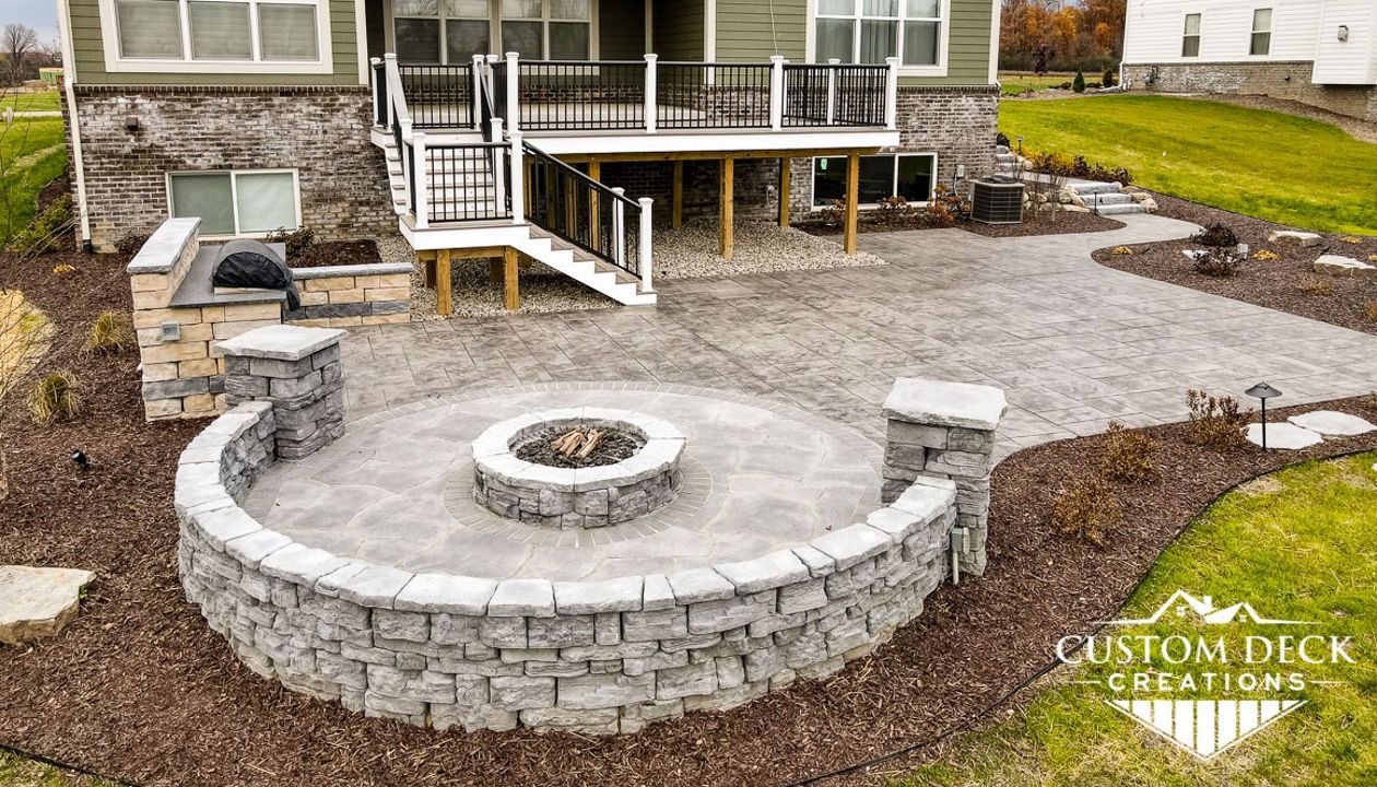 Trex Enhance Naturals Rocky Harbor decking and picture frame. Azek white PVC fascia. Trex Signature aluminum black railing with white Trex composite posts.