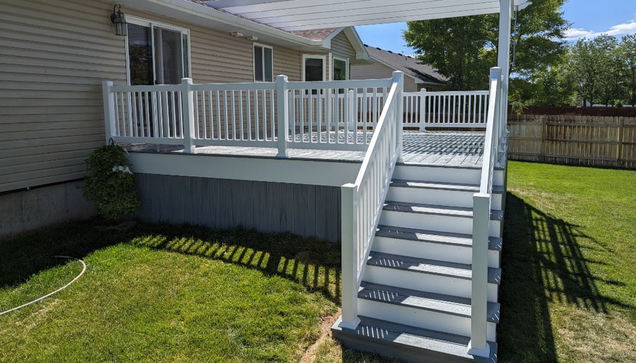 foggy wharf decking and skirting, white vinyl railing and pergola