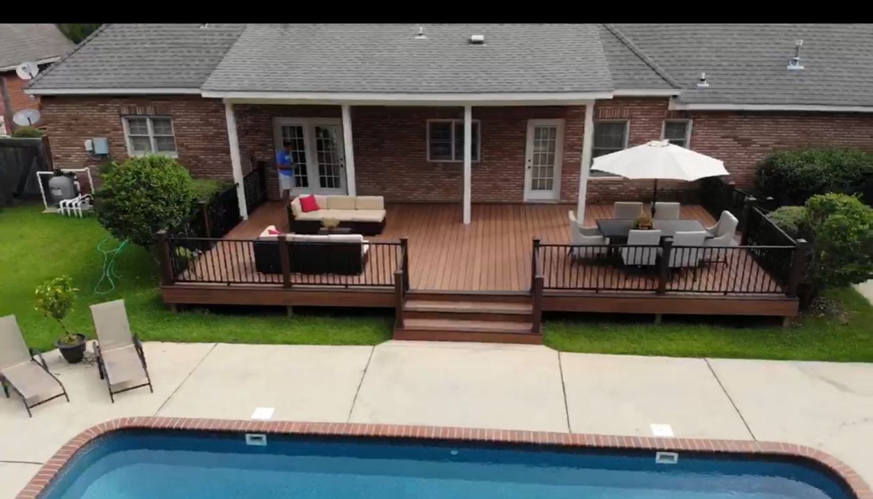 Tiki Torch Decking, Picture Frame in Lava Rock with Signature Black Railing