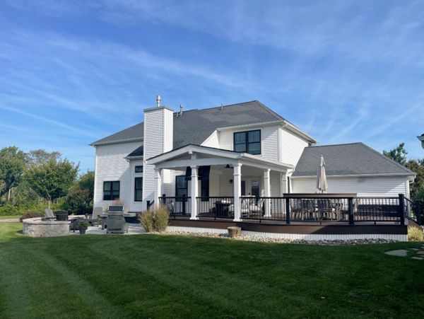 Trex Deck with Spiced Rum Decking, Trex Transcend Rail, Custom Curve, and A-Frame Roof