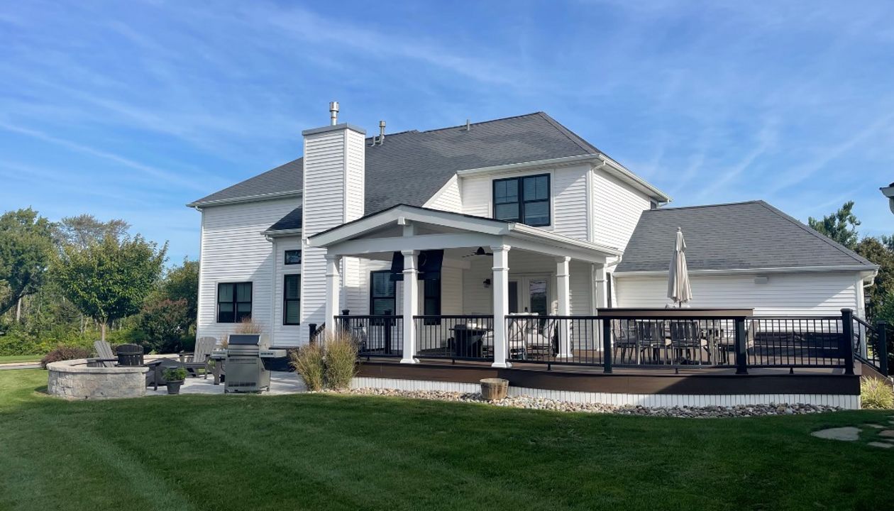 Trex Deck with Spiced Rum Decking, Trex Transcend Rail, Custom Curve, and A-Frame Roof