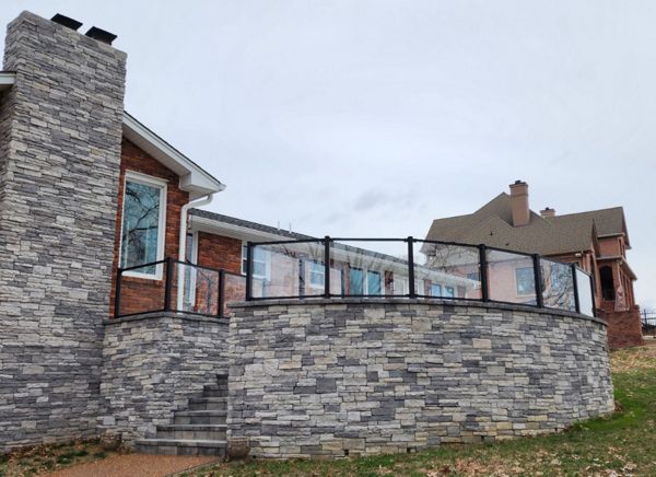 Trex Signature Glass handrails installed on this custom stone patio we built in Hendersonville, TN