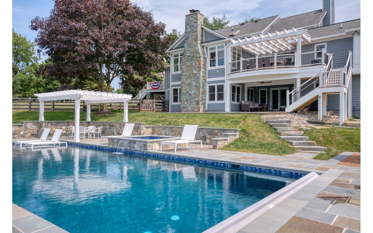 Trex Transcends Deck with Rain Escapes, Trex Pergolas, Custom Pool, & Hardscapes