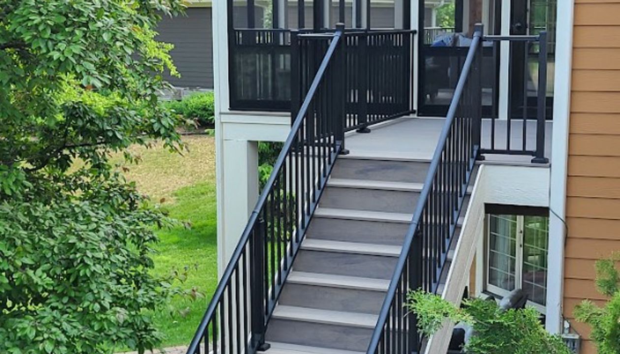 Biscayne decking and custom trim that matches the home really make this backyard pop!