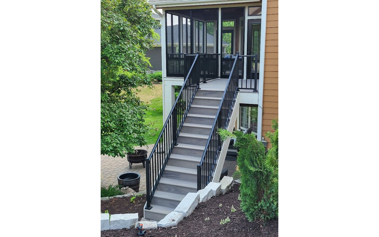 Biscayne decking and custom trim that matches the home really make this backyard pop!