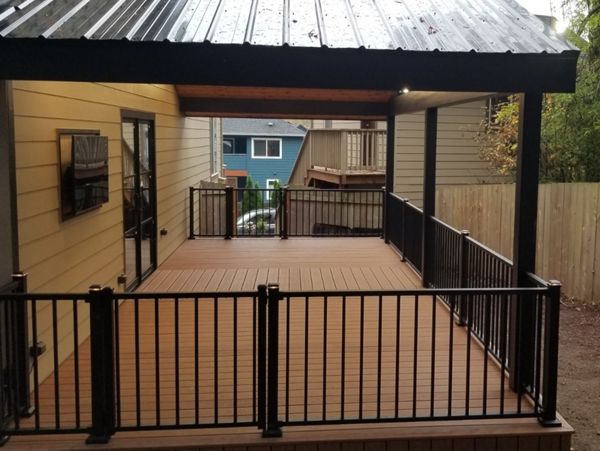 Transcend Tiki Torch decking, Signature railing, lighted post caps and riser lights