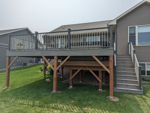 Low maintenance composite decking,Trex Biscayne in color, charcoal aluminum railing,