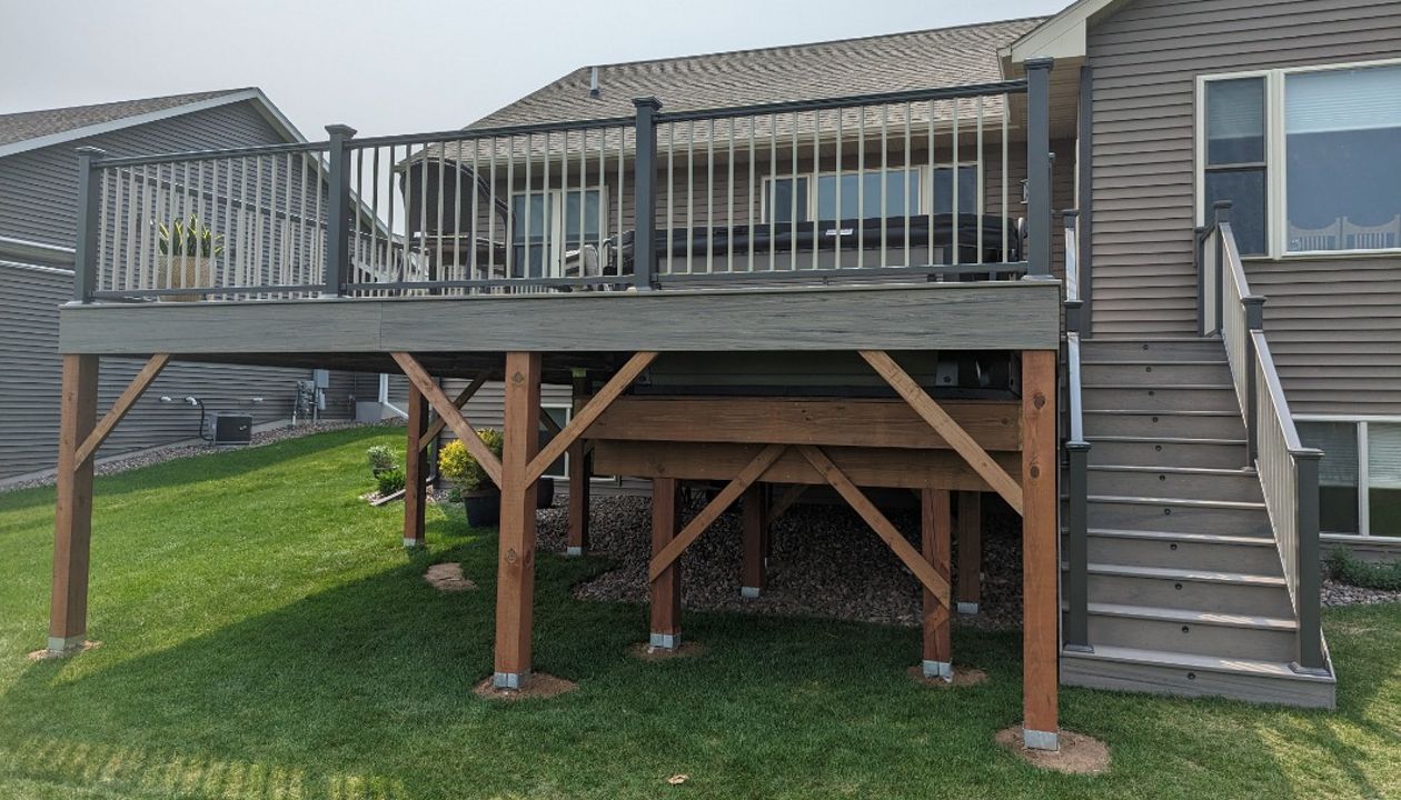 Low maintenance composite decking,Trex Biscayne in color, charcoal aluminum railing,