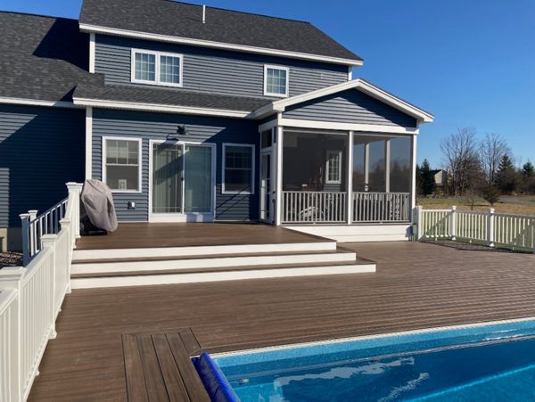 Trex Decking and railing with recessed hottub and pool.