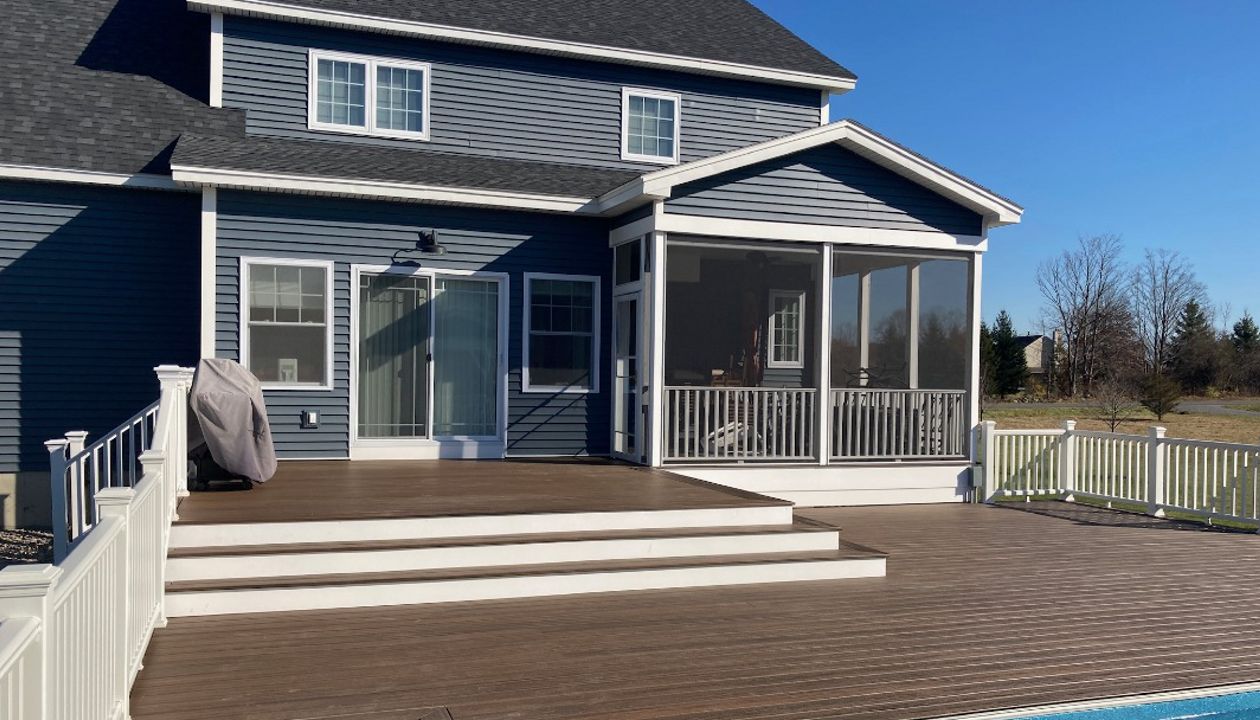 Trex Decking and railing with recessed hottub and pool.