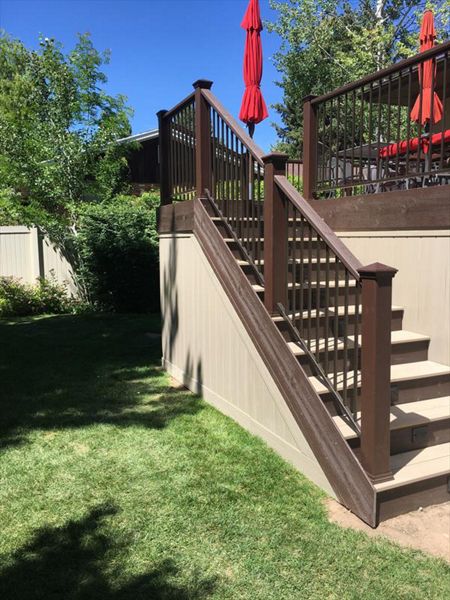 rope swing decking with vintage lantern treads vynal fencing for enclosure