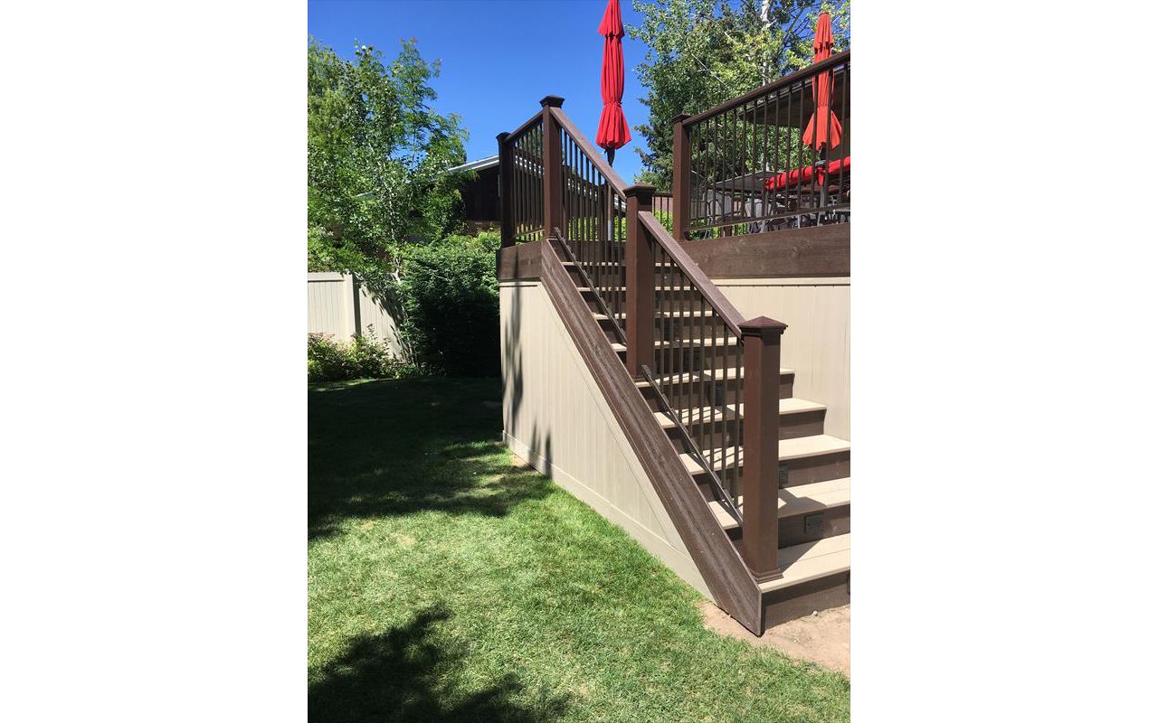 rope swing decking with vintage lantern treads vynal fencing for enclosure