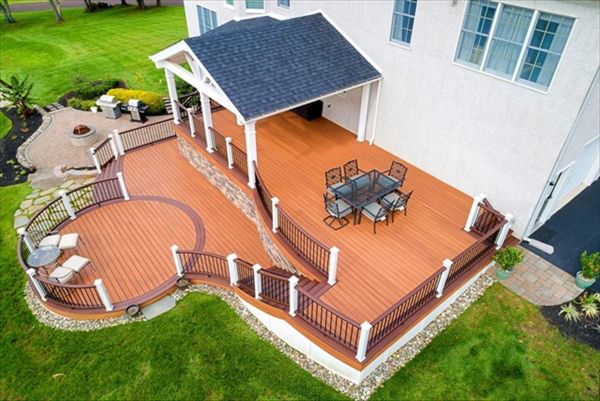 Trex Transcend Tiki Torch and Lava Rock deck with Custom roof.