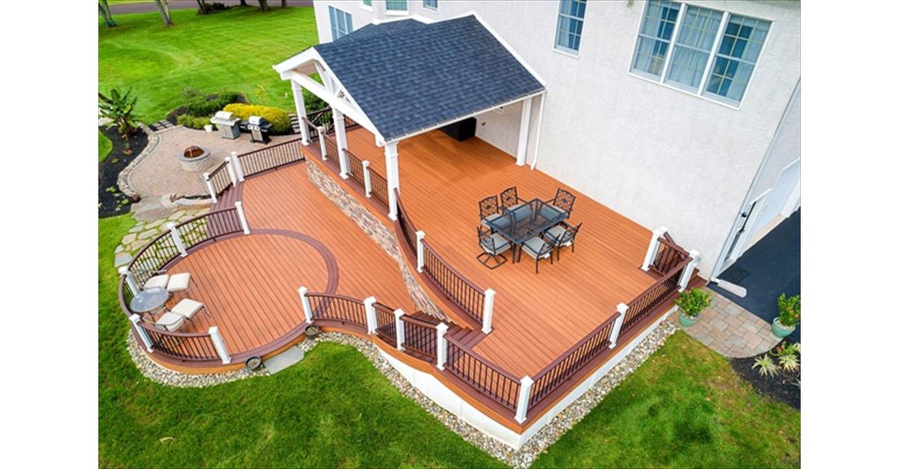 Trex Transcend Tiki Torch and Lava Rock deck with Custom roof.
