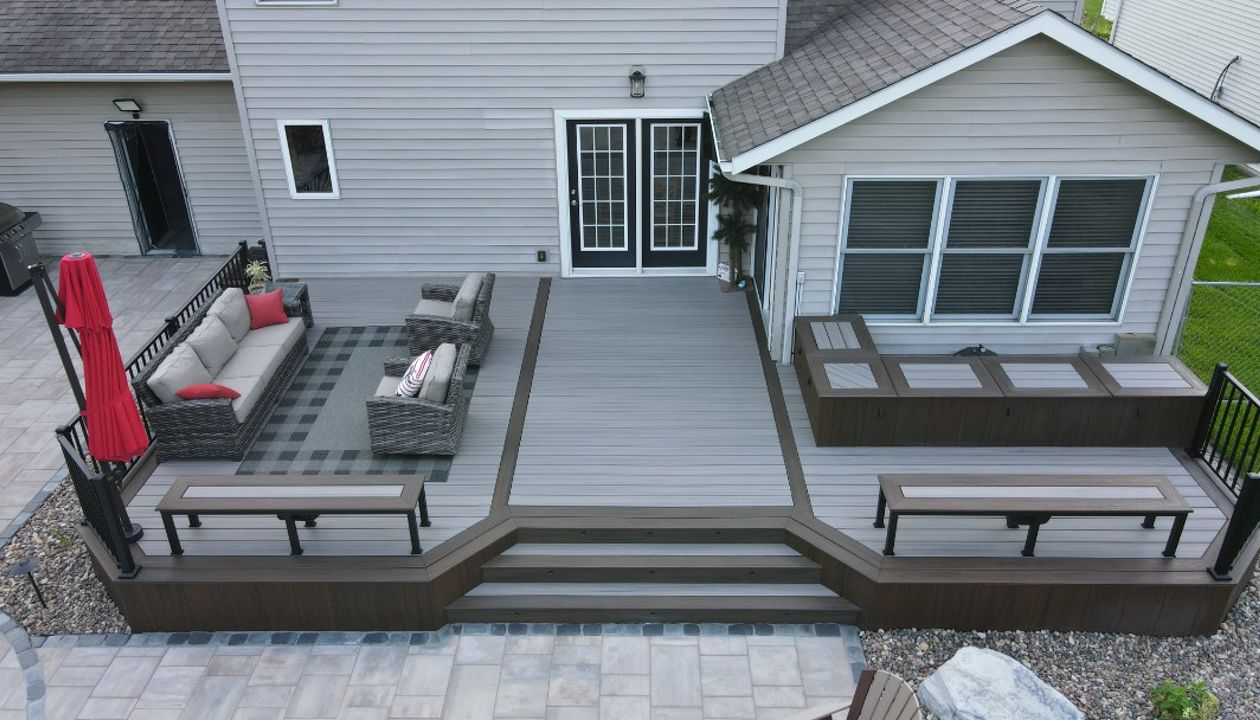 Trex Enhanced Rocky Harbor with Spiced Rum border and fascia with custom benches