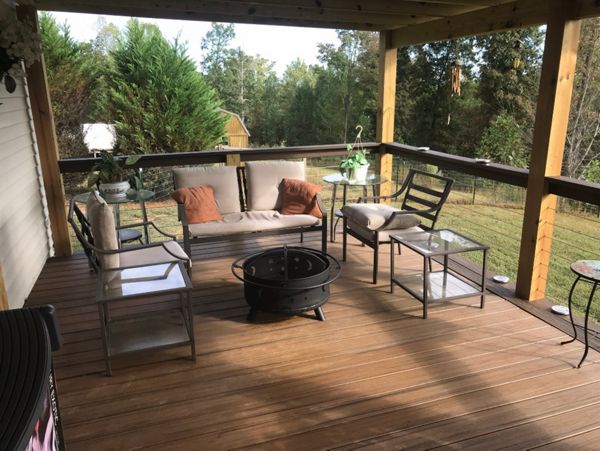 Trex Transcend Havana Gold with Spiced Rum picture frame board gives these homeowners a wonderful place to spend a fall evening making s'mores