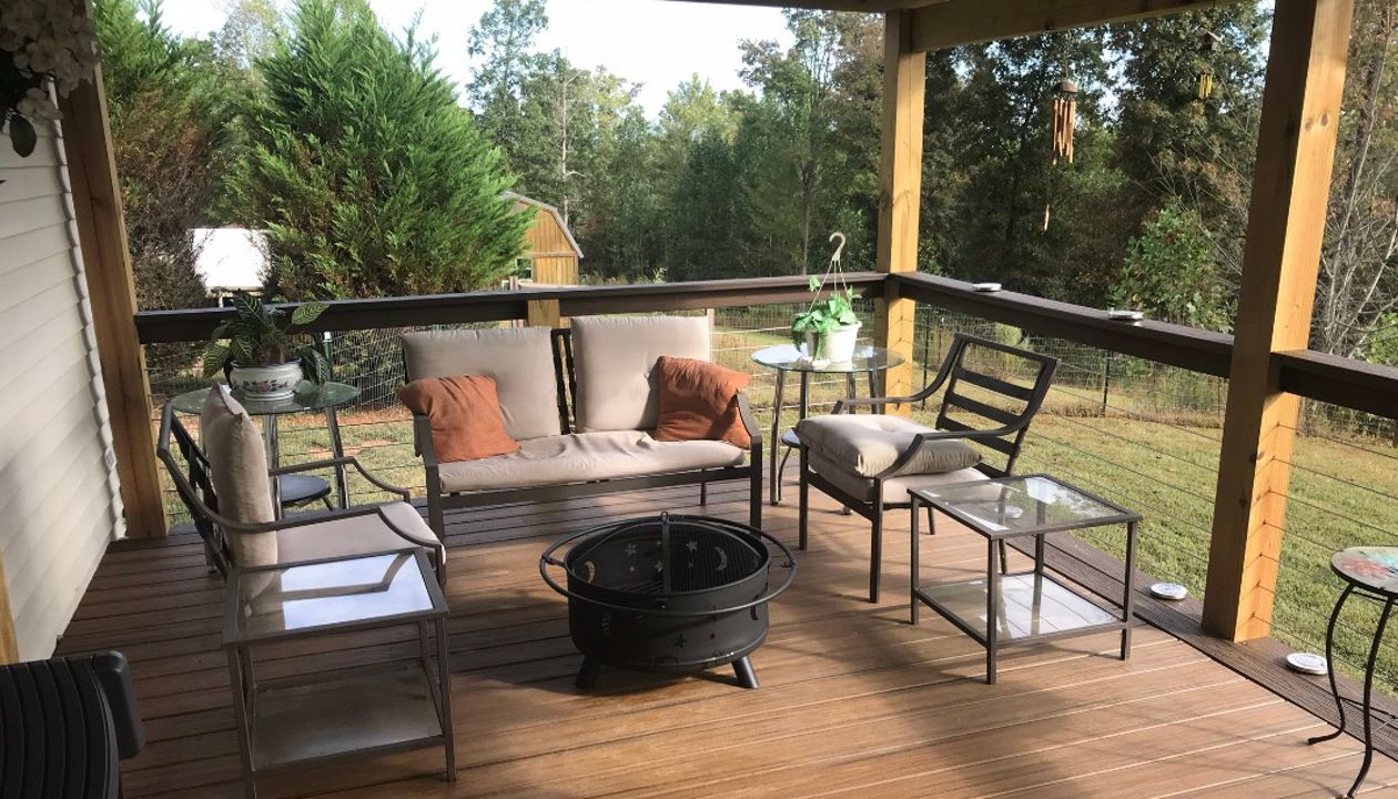 Trex Transcend Havana Gold with Spiced Rum picture frame board gives these homeowners a wonderful place to spend a fall evening making s'mores