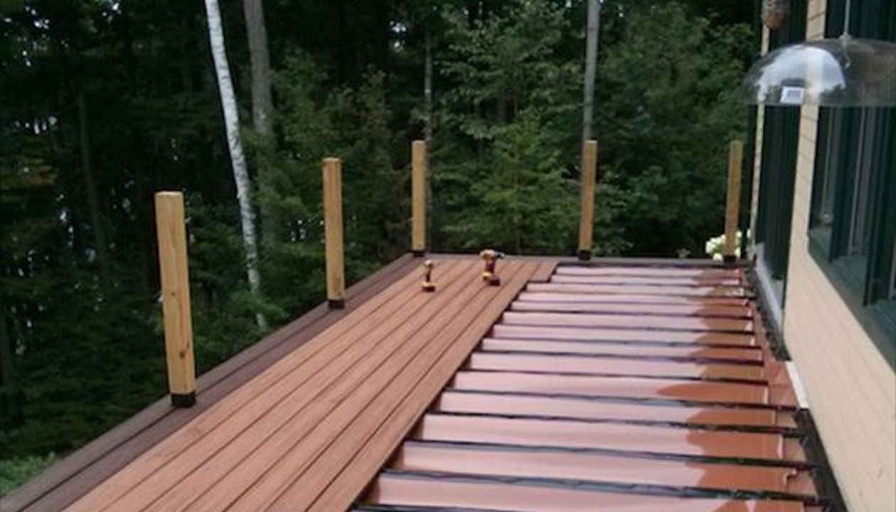 Trex RainEscape system can keep the underside dry. Rain goes into a gutter system in this Darien CT home in Fairfield County CT