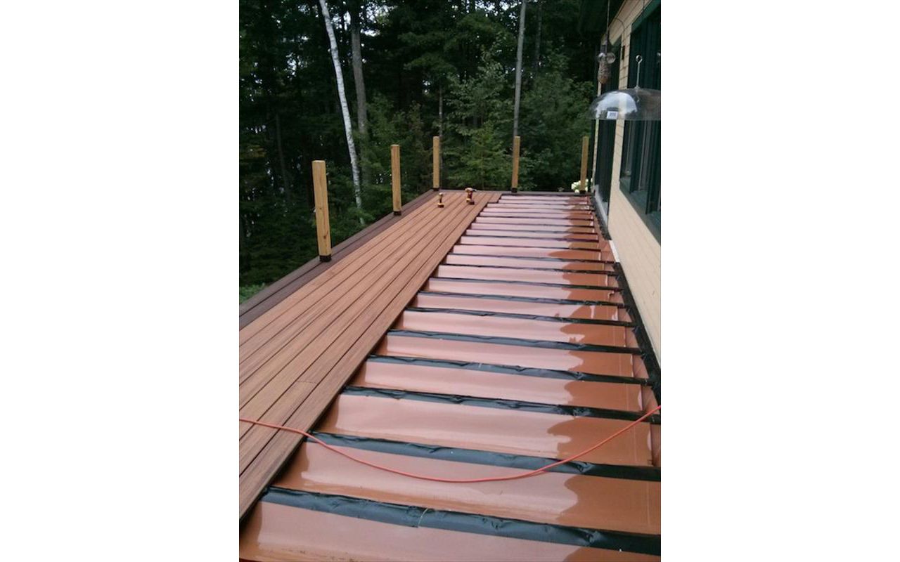 Trex RainEscape system can keep the underside dry. Rain goes into a gutter system in this Darien CT home in Fairfield County CT