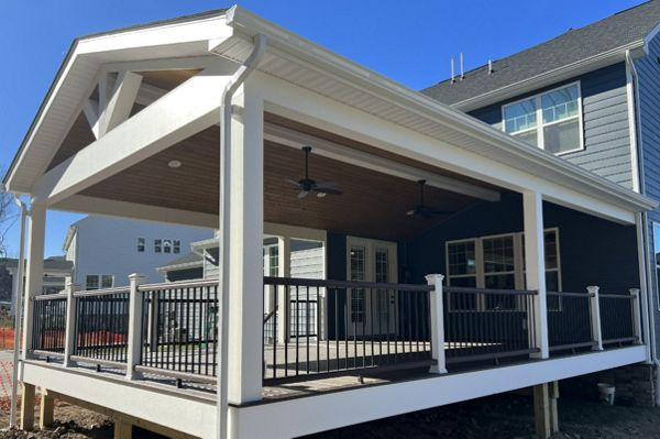 Gable style roof over 20'W x 30'D Spiced Rum deck with Vintage Lantern rail