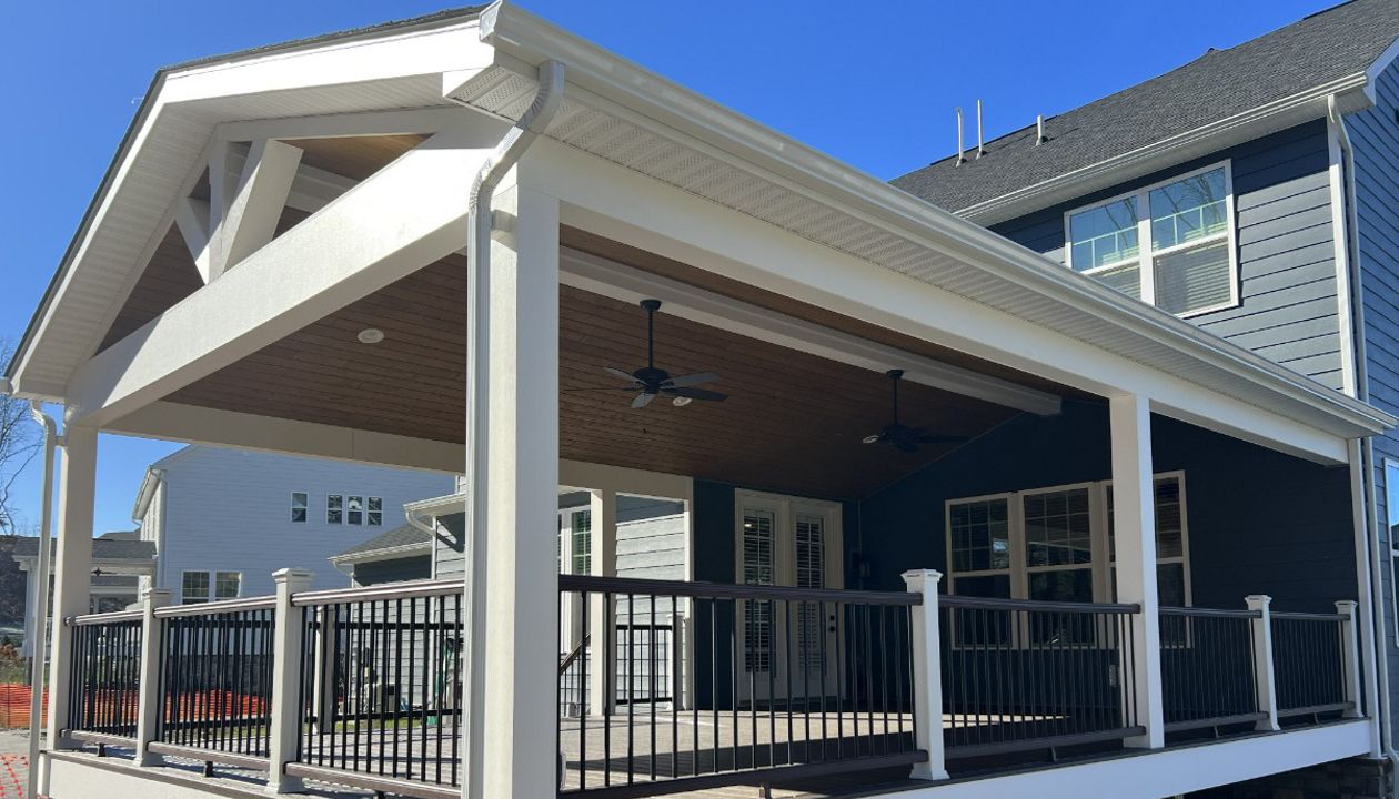 Gable style roof over 20'W x 30'D Spiced Rum deck with Vintage Lantern rail