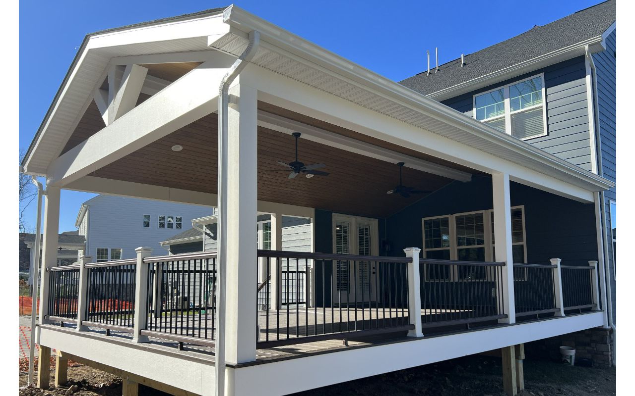 Gable style roof over 20'W x 30'D Spiced Rum deck with Vintage Lantern rail