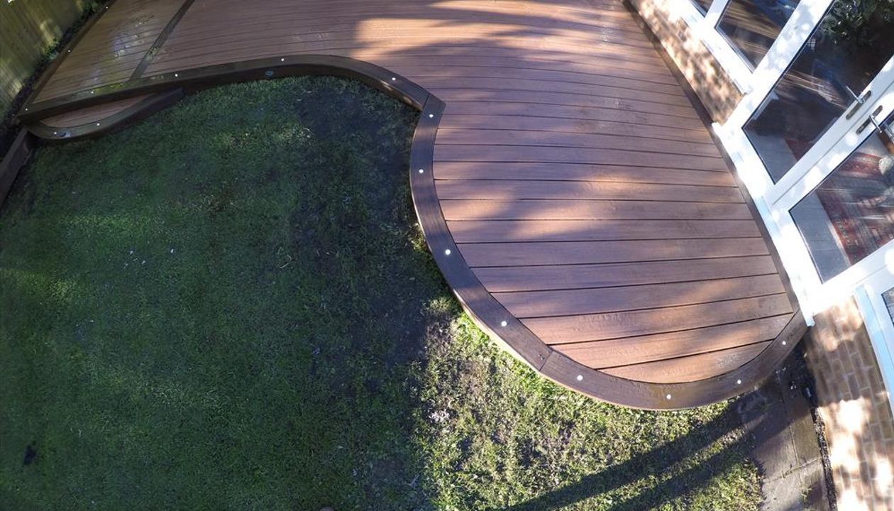 Trex Transcend Tiki Torch Picture framed in Spiced Rum . Custom Curve Instal.Swansea