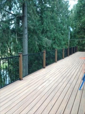 Hillsboro, OR Deck Trex Tiki Torch and Reveal Aluminum Rail