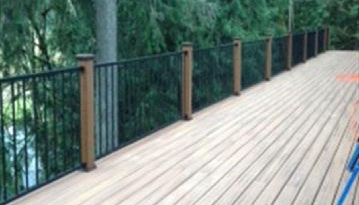 Hillsboro, OR Deck Trex Tiki Torch and Reveal Aluminum Rail