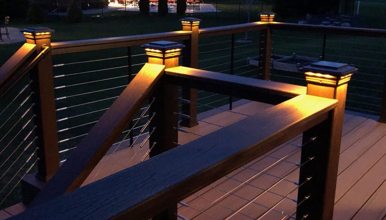 Trex Transcend Tropics Tiki Torch deck boards with Transcend Vintage Lantern Rails, fascia serving the Twin Cites, Post cap lights, deck lighting, picture frame, drink rail, hidden fasteners, Hastings, Woodbury, Egan, Edina, Minneapolis, Lake of the Isles