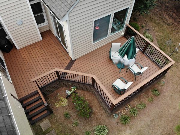 Transcend Tiki Torch field decking with a nice contrasting Lava Rock picture frame. Great details on the stair treads!