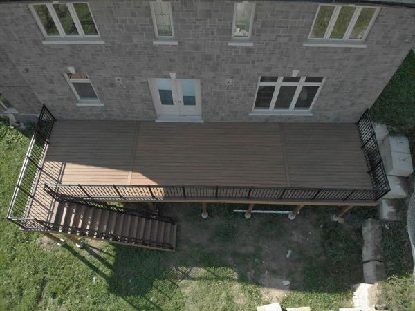 Trex Havana Gold backyard deck done by Royal innovation