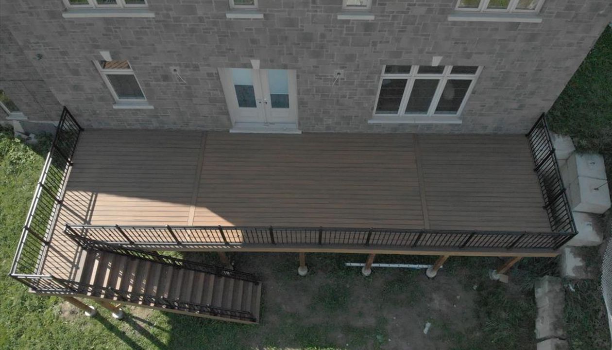 Trex Havana Gold backyard deck done by Royal innovation