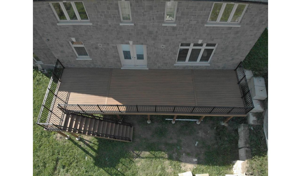 Trex Havana Gold backyard deck done by Royal innovation