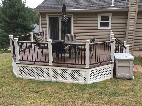 Trex Transcend project in Middletown, CT.  Spiced Rum field featuring a Vintage Lantern border.  - Railings are Trex Transend in Vintage Lantern with black aluminum balusters.