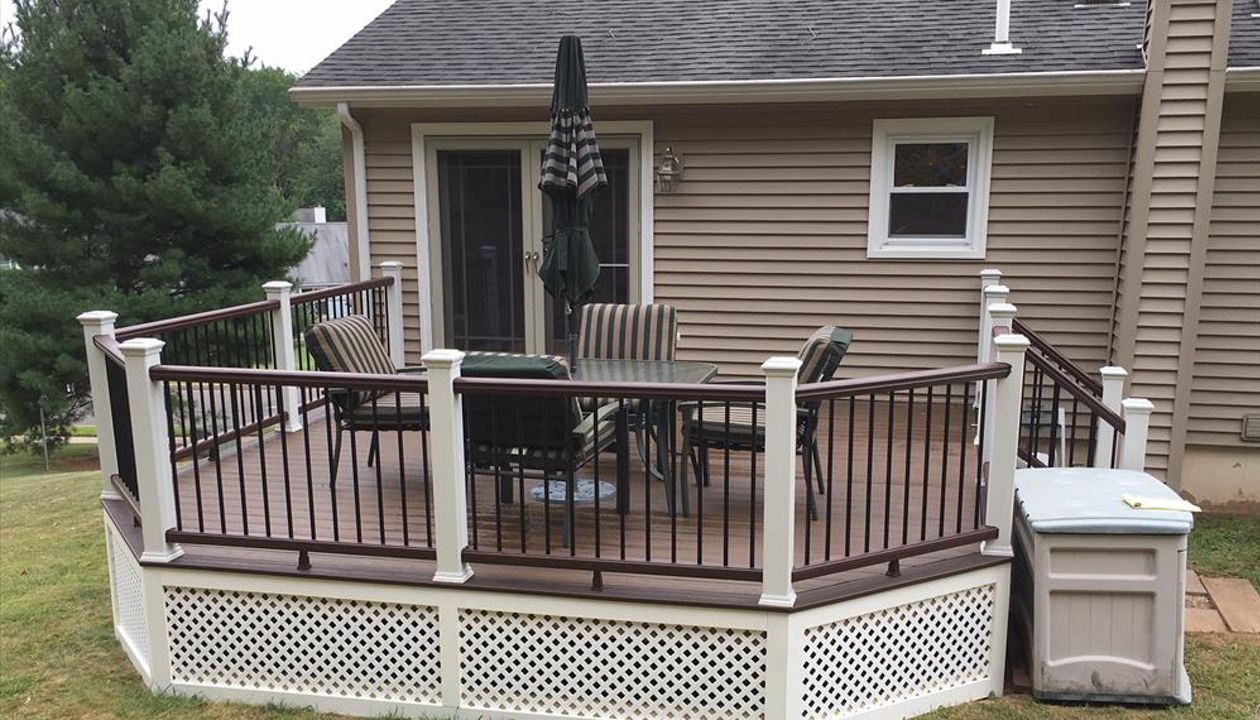 Trex Transcend project in Middletown, CT.  Spiced Rum field featuring a Vintage Lantern border.  - Railings are Trex Transend in Vintage Lantern with black aluminum balusters.