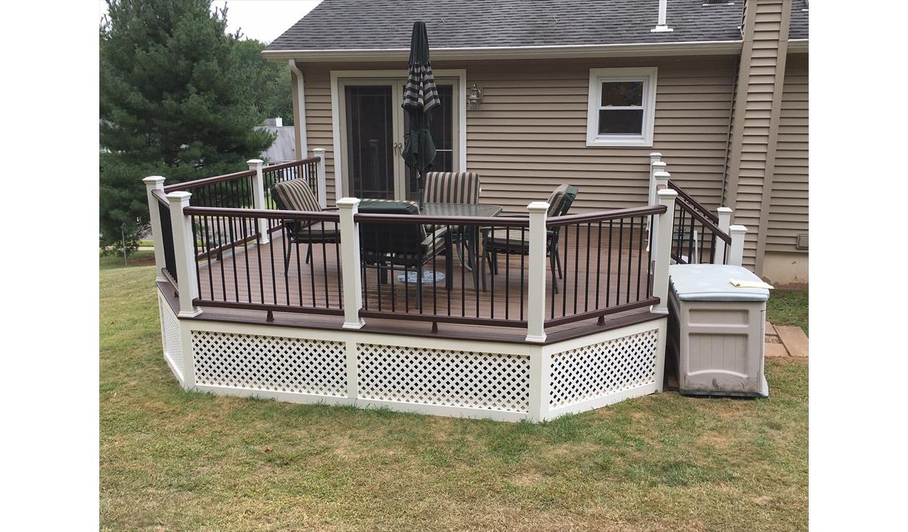 Trex Transcend project in Middletown, CT.  Spiced Rum field featuring a Vintage Lantern border.  - Railings are Trex Transend in Vintage Lantern with black aluminum balusters.