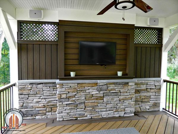 Trex Transcend decking in Havana Gold and Spiced Rum created a custom TV Wall under a covered pavilion in Upper Saddle River, NJ.