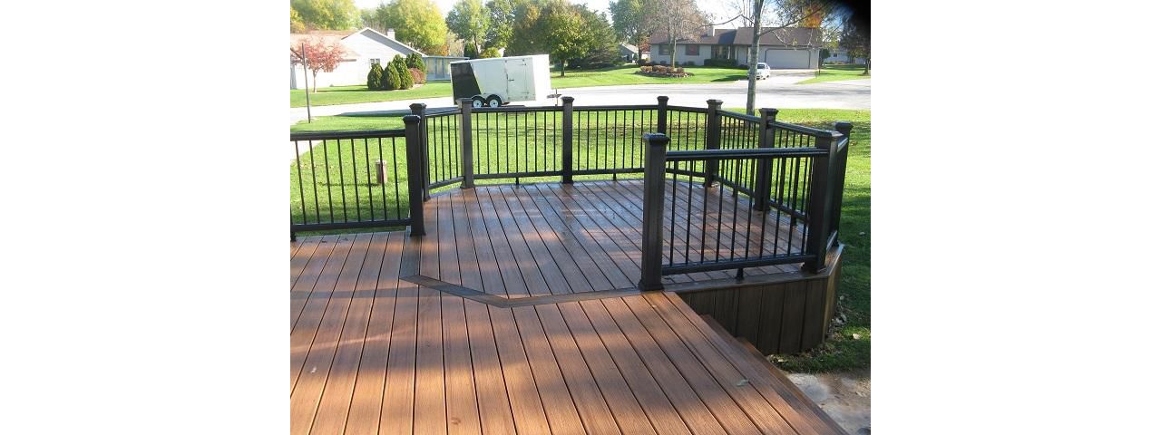Green Bay - Tiki Torch/Lava rock decking, Black railing