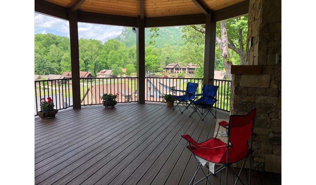 Trex Transcend Lava Rock decking &amp; Trex Signature Bronze railing look fantastic on this rustic style custom home &amp; covered porch