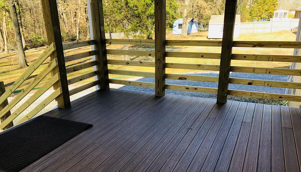 Deck to covered porch project with Trex Spiced Rum Porch Boards