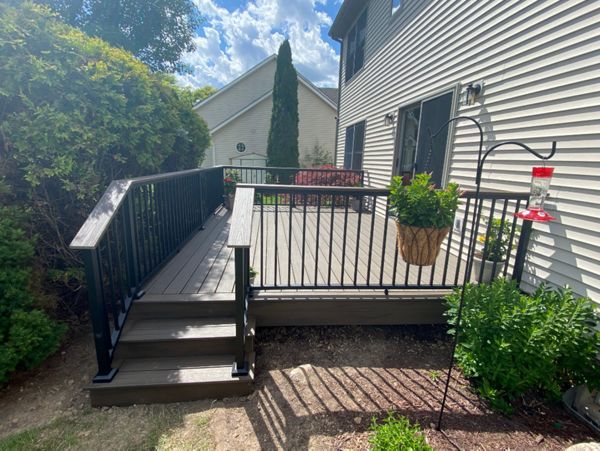 Enhanced Naturals - Coastal Bluff decking, picture frame and fascia with a Transcends - Spiced Rum drink rail