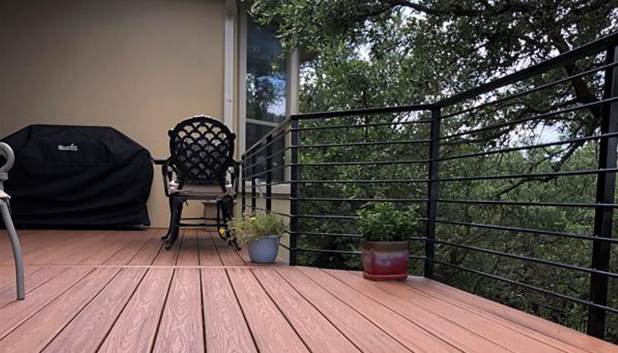 Nice shaded back yard with Trex Transcend Tiki Torch by Austin Deck Company, Austin TX