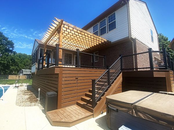 Trex Deck (Saddle) with Horizontal Deck Skirting, Trex Fascia, Trex Transcend, and Stainless-Steel Cable Rail. Rough Swan Cedar Pergola.