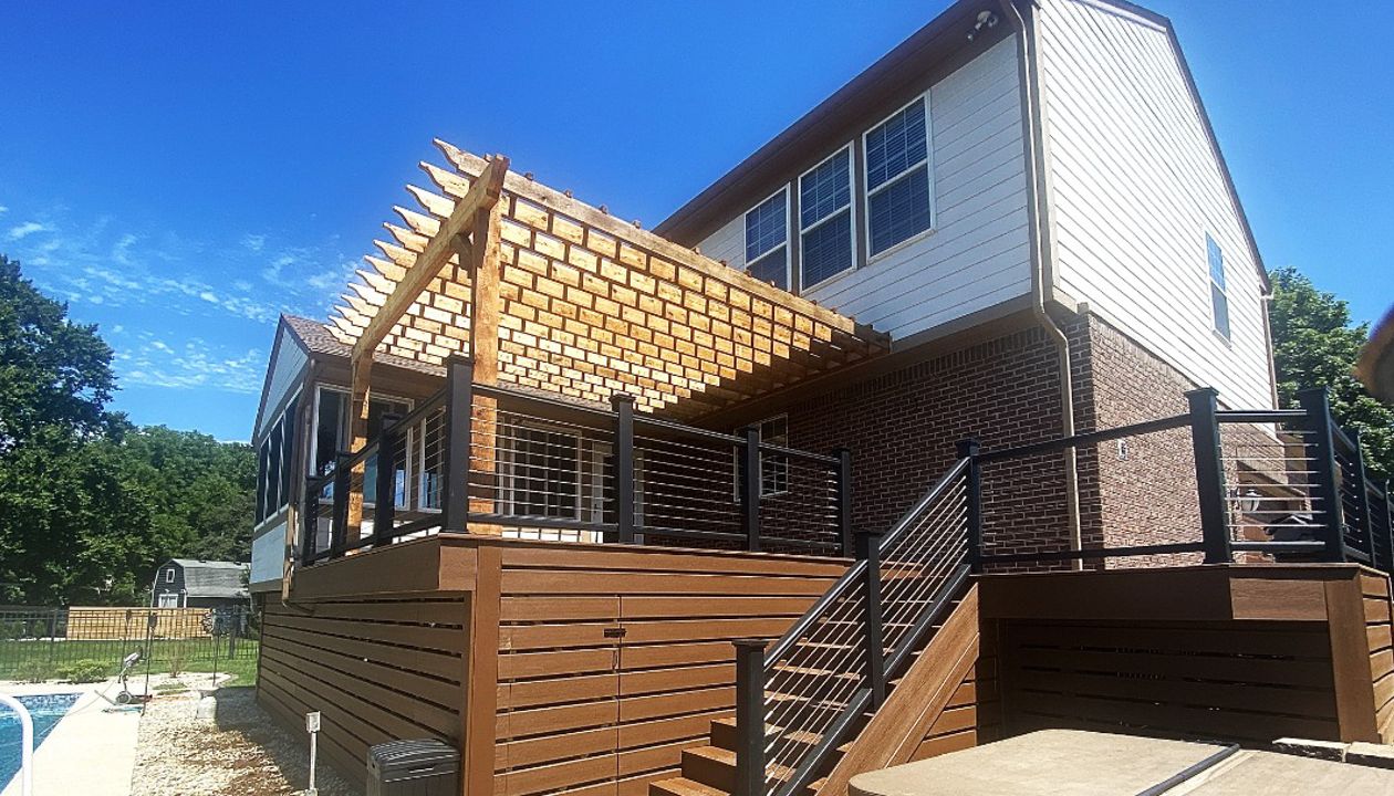 Trex Deck (Saddle) with Horizontal Deck Skirting, Trex Fascia, Trex Transcend, and Stainless-Steel Cable Rail. Rough Swan Cedar Pergola.